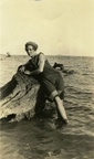 fay_viosca_pics_015 -- Alice Baudean posing by a blown down tree stump.  Probably taken in Mandeville after the 1915 hurricane. On the back it says, "That position is awful."