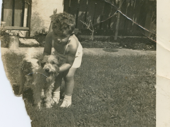 VicVioscaAlbum_074 (1572 visits) On back: Victor Willard Vioscaa Jr. with his dog "Rags" in yard - 5762 Catina St. 3 years old. VicVioscaAlbum_074